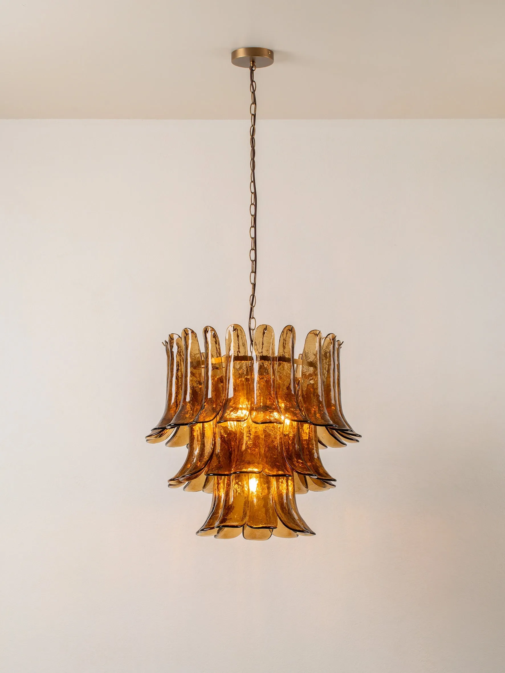 Lonso - 4 light aged brass and smoked brown glass chandelier